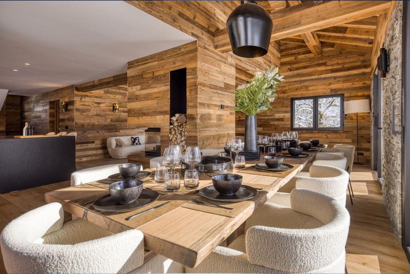 Dining area of the chalet, set for shared meals after a day on the slopes
